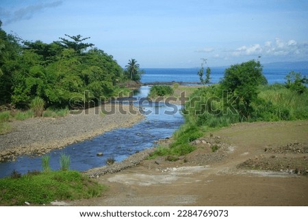 shallow river on the beach Royalty-Free Stock Photo #2284769073