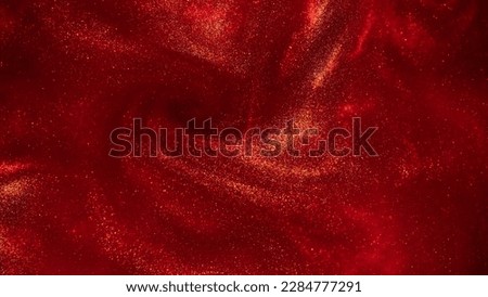 Swirls of Gold Dust Particles in Red Liquid. Magical waves of golden glittering particles in various hues of red with a depth of field. Abstract shiny background. Royalty-Free Stock Photo #2284777291
