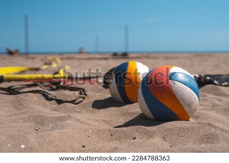 beach volleyball swords lie on the sand