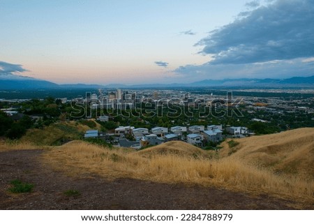 Salt Lake City modern city skyline with Utah State Capitol building at sunrise in Salt Lake City, Utah UT, USA.