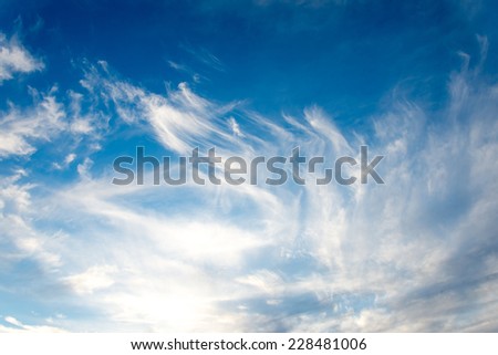 blue sky with white clouds closeup over the sea