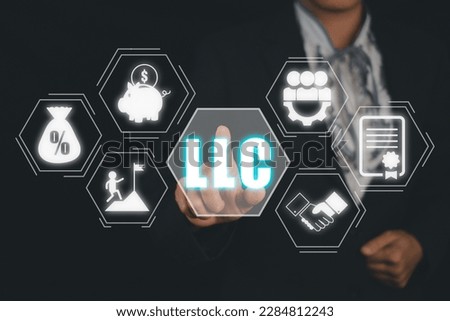 Limited Liability Company (LLC) Business Concept, Person hand touching limited liability company icon on virtual screen. Royalty-Free Stock Photo #2284812243