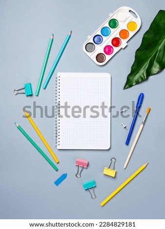 table with open notebook with ballpoint pen, stationery. Business concept planning a day, writing a to-do list, checklist. Top view of workspace