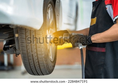 A tire changer works in a tire change center.