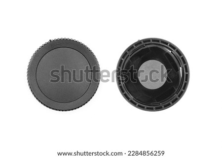Black front cap to protect the lens on a white background without logo front and back close-up view