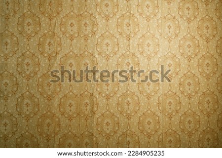 Old wallpaper on the wall. Old wallpaper for texture or background. Royalty-Free Stock Photo #2284905235
