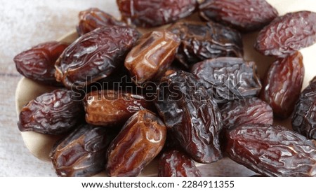 Kurma Medjool (medjool dates), pleasantly plump, larger, darker, and more caramel-like in taste. Iftar food, breaking the fast. Royalty-Free Stock Photo #2284911355