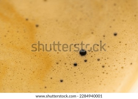Coffee foam extreme close up. Macro texture and background.
