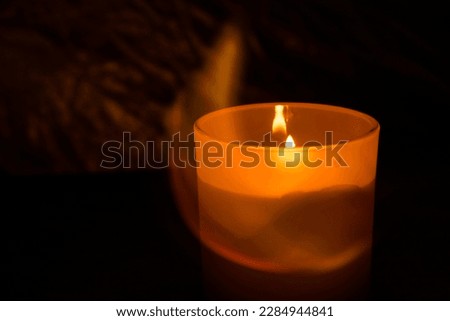 Candle lights on the dark background, romantic scenery