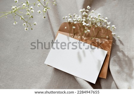 Blank paper card, postcard mockup with copy space, an aesthetic greeting holiday postcard floral template