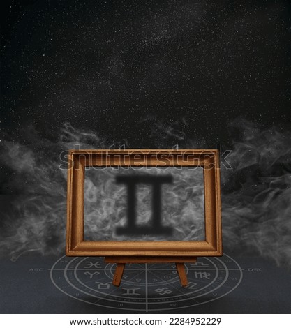 Abstract image of the sign of the zodiac Gemini against the background of the starry sky and smoke in a frame on a stand