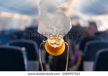 oxygen mask drop from the ceiling compartment on airplane	
 Royalty-Free Stock Photo #2284957561