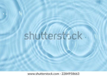 Blue water texture, blue water surface with rings and ripples. Spa concept background. Flat lay Royalty-Free Stock Photo #2284958663