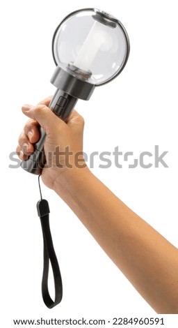 Hand Holding K pop light stick isolated on white background, Hand Holding light stick on white Background With clipping path. Royalty-Free Stock Photo #2284960591