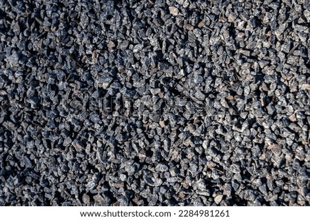 Small stones wall used for background texture.Small Rock Textured background. Seamless texture of gravel. crushed granite texture.
