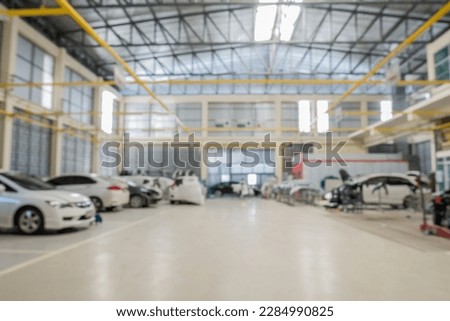 car service centre auto repair body paint workshop blurred background Royalty-Free Stock Photo #2284990825