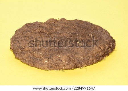 Dry Cow Dung Cakes for Hawan Kund. Cow dung used made incense sticks in India. dung cake for dhup Royalty-Free Stock Photo #2284991647