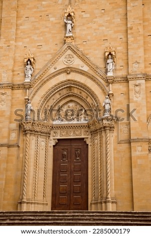 An imposing Gothic construction, begun at the end of the thirteenth century and continued with various interruptions until the beginning of the sixteenth century, the Cathedral dominates the city Royalty-Free Stock Photo #2285000179