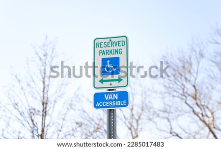 The handicap sign is a blue and white symbol of accessibility. It represents the need for barrier-free access for individuals with disabilities, ensuring their equal participation in society. Royalty-Free Stock Photo #2285017483