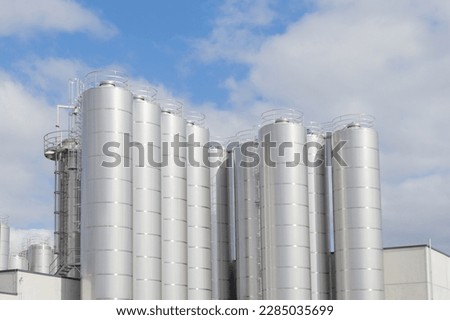 A close up of Industrial silos for food milk production Royalty-Free Stock Photo #2285035699