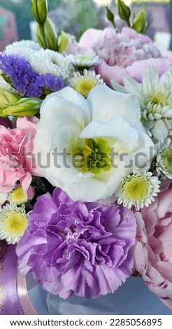 An unusual bouquet of pink peonies and summer flowers, close-up. A fresh spring bouquet.