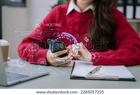 Woman using computer, tablet and presses his finger on the virtual screen inscription Hosting on desk, Web hosting concept, Internet, business, digital technology concept.