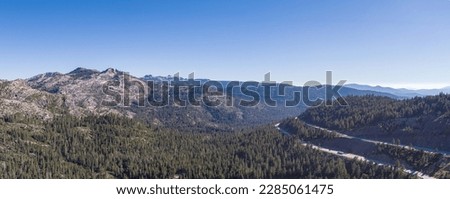 Interstate highway road wraps aroung the mountains of northern California near Lake Tahoe. Royalty-Free Stock Photo #2285061475