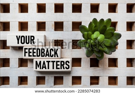 YOUR FEEDBACK MATTERS - words from wooden blocks with letters, Your feedback is important concept, top view.