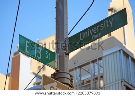 Green East 13th Street and University Place traditional sign in Midtown Manhattan in New York City