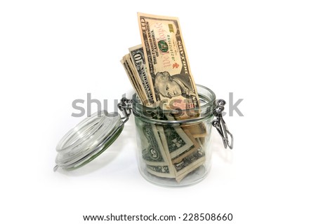 abstract image storage dollars in a glass jar