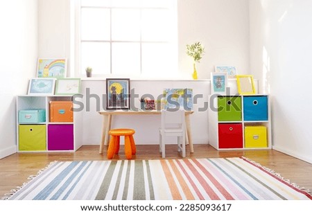 Comfortable room with colourful furniture in sunny day. Royalty-Free Stock Photo #2285093617