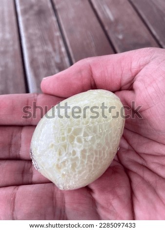 frozen egg in a man hand