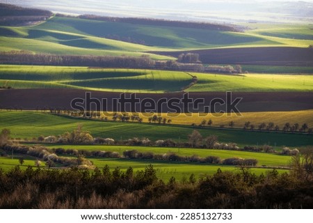 Amazing scenery of the South Moravian landscape in the light of the setting sun. Moravian Tuscany. Royalty-Free Stock Photo #2285132733