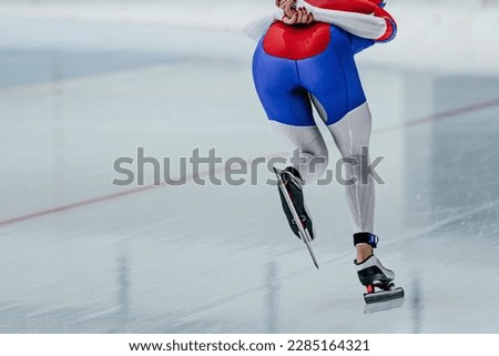 back female skaters running rink in speed skating competition, winter sports games