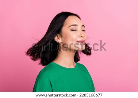Profile photo of cute gorgeous person closed eyes flying hair isolated on pink color background