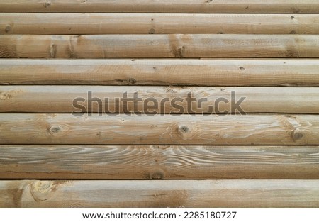 Front view of brown wooden log wall for background