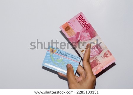 KTP and money on white background