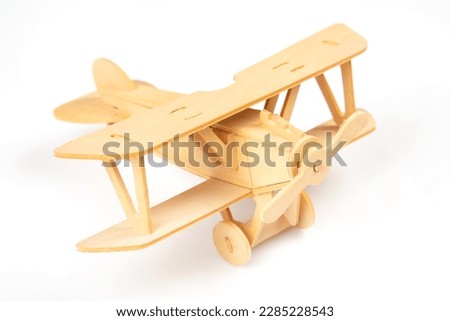 Wooden aircraft model. constructor for assembling toys Royalty-Free Stock Photo #2285228543