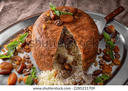Aromatic Shah Pilaf with Golden Raisins, Dried Apricots and Walnuts Royalty-Free Stock Photo #2285231709