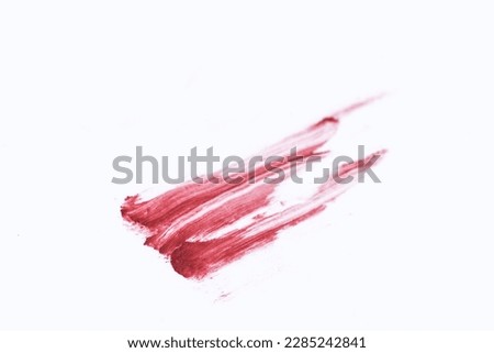 Lipstick smudged on white with clipping path.