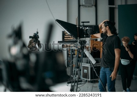 Film set, monitors and modern shooting equipment. Film crew, lighting devices, monitors, playbacks - filming equipment and a team of specialists in filming movies, advertising and TV series Royalty-Free Stock Photo #2285243191