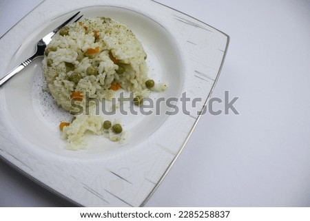 Plate of rice placed on white background, close-up, plate of rice.  veggie, fork, presentation, space, copy,