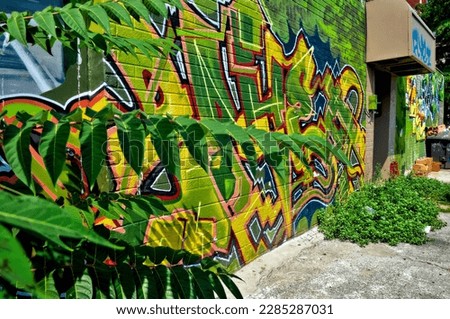 Street art, background.  Abstract colourful graffiti paintings on the concrete wall.  