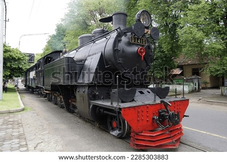 Vintage and historic black steam train. Selective focus on locomotive. Royalty-Free Stock Photo #2285303883