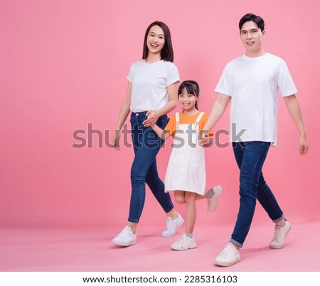 Young Asian family on background