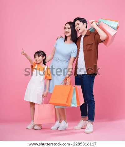 Young Asian family on background