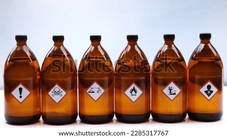 Warning symbol for chemical hazard on chemical container, chemical in laboratory and industry  Royalty-Free Stock Photo #2285317767