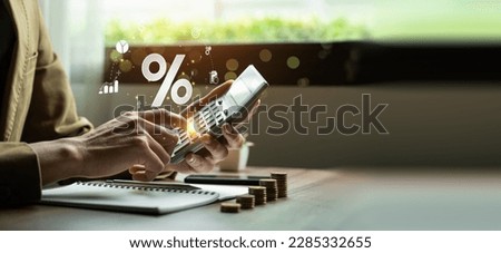 Interest rate and dividend concept, Businessman is calculating income and return on investment in percentage. income, return, retirement, compensation fund, investment, dividend tax, stock market Royalty-Free Stock Photo #2285332655