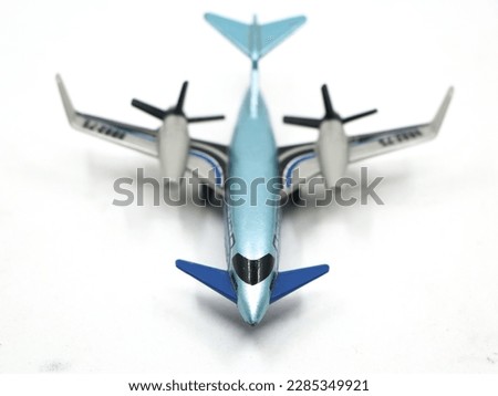 a blue airplane jet toy isolated in a white background