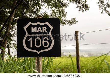 Municipal road sign MAR 106, located in the city of Marília, state of Sao Paulo, Brazil. The road connects the Jardim Aeroporto neighborhood to the Dirceu district.